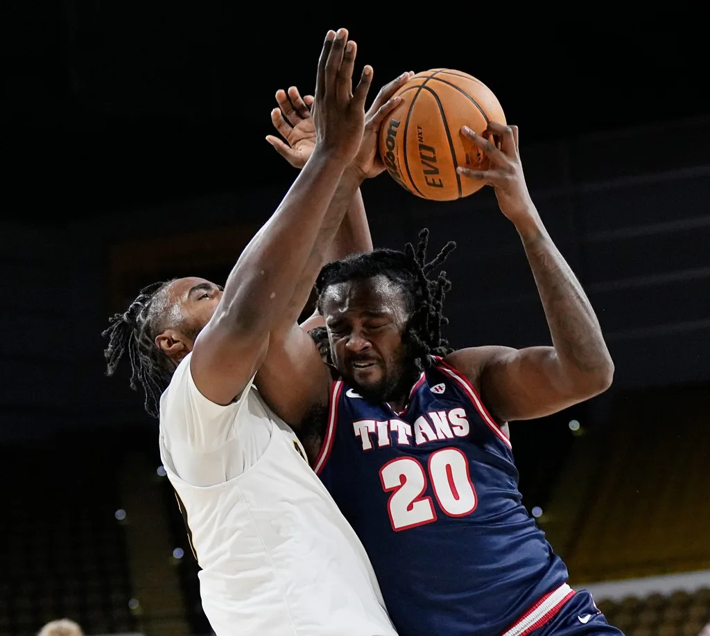 Milwaukee Panthers guard Aaron Franklin (29) attempts to block Detroit Mercy Titans forward London Maiden (20) during the first half of the game on Wednesday February 4, 2026 at the UW-Milwaukee Panther Arena in Milwaukee, Wisconsin.
