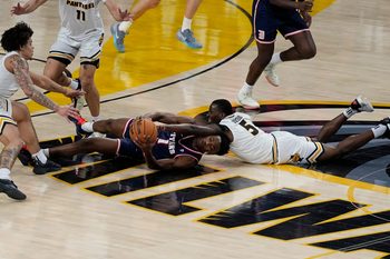 Milwaukee Panthers guard Isaiah Dorceus (5) and Detroit Mercy Titans guard Tyler Spratt (1) try to gain possession of the ball during the first half of the game on Wednesday February 4, 2026 at the UW-Milwaukee Panther Arena in Milwaukee, Wisconsin.