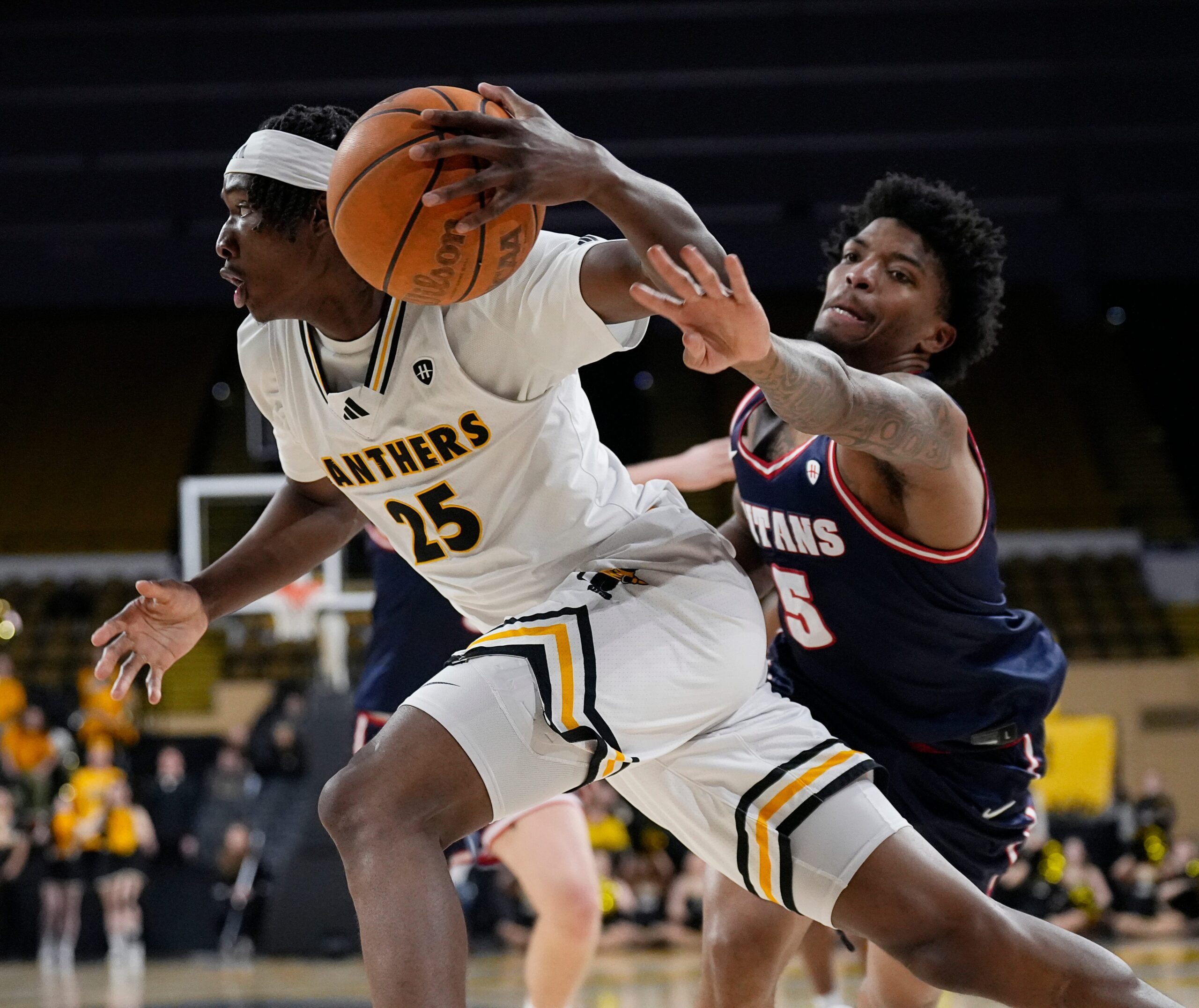Detroit Mercy Titans guard Orlando Lovejoy (5) attempts to reach for the ball against Milwaukee Panthers forward Sekou Konneh (25) during the second half of the game on Wednesday February 4, 2026 at the UW-Milwaukee Panther Arena in Milwaukee, Wisconsin.