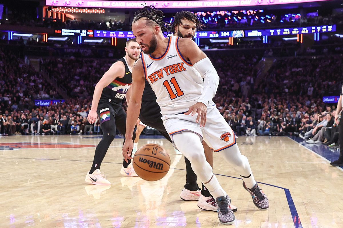 Feb 4, 2026; New York, New York, USA;  New York Knicks guard Jalen Brunson (11) spins away from Denver Nuggets guard Jamal Murray (27) in the fourth quarter at Madison Square Garden. Mandatory Credit: Wendell Cruz-Imagn Images
