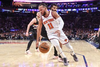 Feb 4, 2026; New York, New York, USA;  New York Knicks guard Jalen Brunson (11) spins away from Denver Nuggets guard Jamal Murray (27) in the fourth quarter at Madison Square Garden. Mandatory Credit: Wendell Cruz-Imagn Images