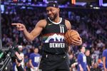 Feb 4, 2026; New York, New York, USA;  Denver Nuggets guard Bruce Brown (11) points to a fan after making a jump shot at the buzzer to end the first quarter against the New York Knicks at Madison Square Garden. Mandatory Credit: Wendell Cruz-Imagn Images