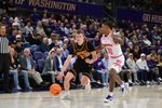 Feb 4, 2026; Seattle, Washington, USA; Iowa Hawkeyes guard Bennett Stirtz (14) dribbles the ball while guarded by Washington Huskies guard Courtland Muldrew (30) during the second half at Alaska Airlines Arena at Hec Edmundson Pavilion. Mandatory Credit: Steven Bisig-Imagn Images