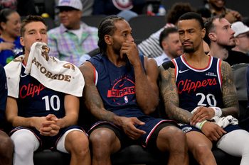 Feb 4, 2026; Inglewood, California, USA; Los Angeles Clippers guard Bogdan Bogdanovic (10), Los Angeles Clippers forward Kawhi Leonard (2) and Los Angeles Clippers forward John Collins (20) sit on the bench in the fourth quarter the Cleveland Cavaliers at Intuit Dome. Mandatory Credit: Jayne Kamin-Oncea-Imagn Images