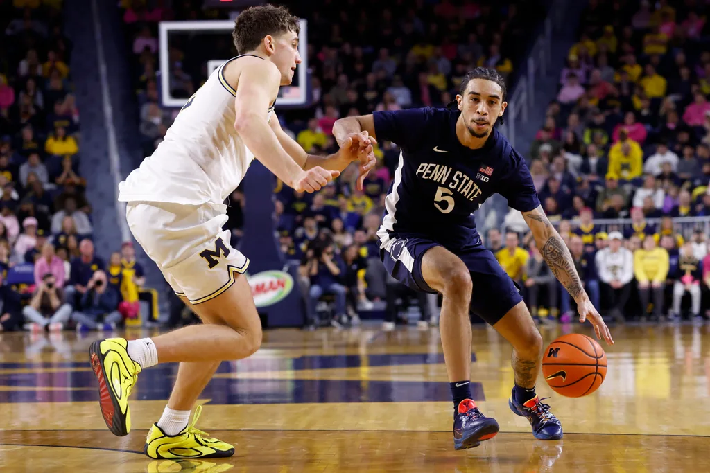 Feb 5, 2026; Ann Arbor, Michigan, USA; Penn State Nittany Lions guard Freddie Dilione V (5) dribbles against Michigan Wolverines forward Will Tschetter (42) in the second half at Crisler Center. Mandatory Credit: Rick Osentoski-Imagn Images