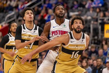 Feb 5, 2026; Detroit, Michigan, USA; Detroit Pistons forward Paul Reed (7) battles for position between Washington Wizards guard Will Riley (27) and forward Anthony Gill (16) during the second half at Little Caesars Arena. Mandatory Credit: David Reginek-Imagn Images