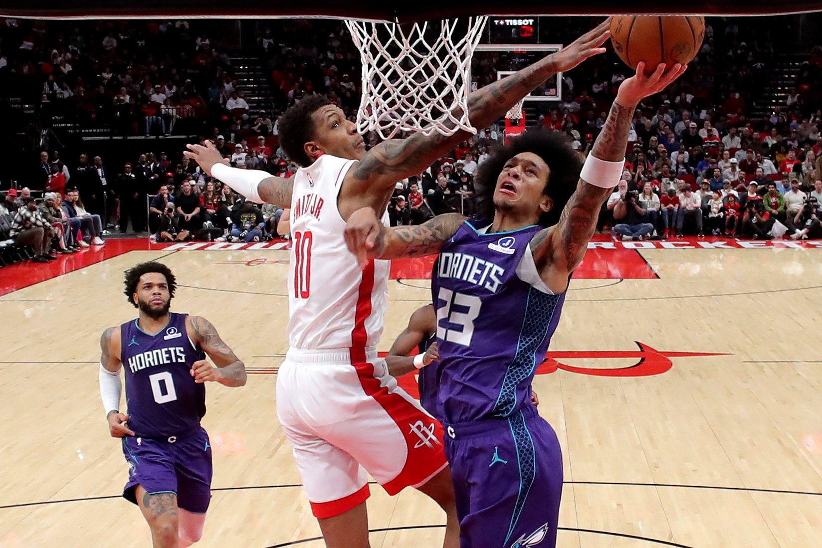 Feb 5, 2026; Houston, Texas, USA; Houston Rockets forward Jabari Smith Jr. (10) blocks a shot by Charlotte Hornets guard Tre Mann (23) during the fourth quarter at Toyota Center. Mandatory Credit: Erik Williams-Imagn Images