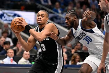 Feb 5, 2026; Dallas, Texas, USA; San Antonio Spurs forward Keldon Johnson (3) drives to the basket past Dallas Mavericks center Moussa Cisse (30) during the second half at the American Airlines Center. Mandatory Credit: Jerome Miron-Imagn Images