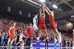 Jan 31, 2026; Spokane, Washington, USA; Saint Mary's Gaels forward Paulius Murauskas (23) fights for the rebound against Gonzaga Bulldogs forward Emmanuel Innocenti (5) in the first half at McCarthey Athletic Center. Mandatory Credit: James Snook-Imagn Images