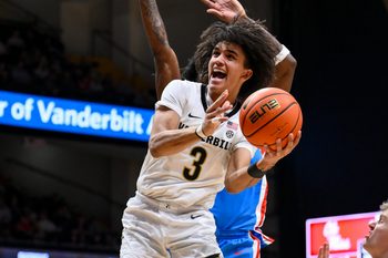 Jan 31, 2026; Nashville, TN, USA;  Vanderbilt Commodores guard Tyler Tanner (3) shoots the ball over Mississippi Rebels guard AJ Storr (2) during the second half at Memorial Gymnasium. Mandatory Credit: Steve Roberts-Imagn Images