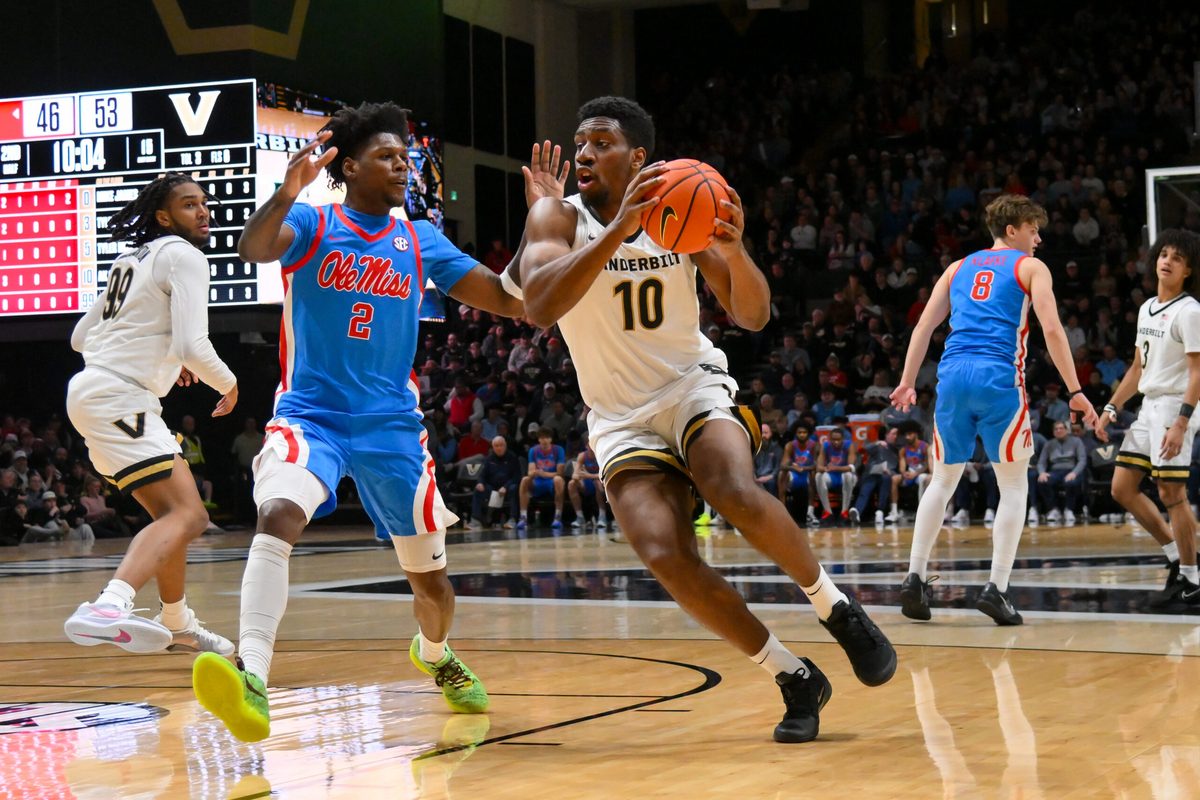 Jan 31, 2026; Nashville, TN, USA;  Vanderbilt Commodores forward Ak Okereke (10) drives to the basket past Mississippi Rebels guard AJ Storr (2) during the second half at Memorial Gymnasium. Mandatory Credit: Steve Roberts-Imagn Images