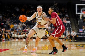 Jan 24, 2026; Columbia, Missouri, USA; Missouri Tigers guard Jacob Crews (35) drives against Oklahoma Sooners guard Nijel Pack (9) during the first half at Mizzou Arena. Mandatory Credit: Jay Biggerstaff-Imagn Images