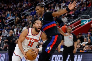 Feb 6, 2026; Detroit, Michigan, USA;  New York Knicks guard Jalen Brunson (11) dribbles on Detroit Pistons guard Ausar Thompson (9) in the first half at Little Caesars Arena. Mandatory Credit: Rick Osentoski-Imagn Images