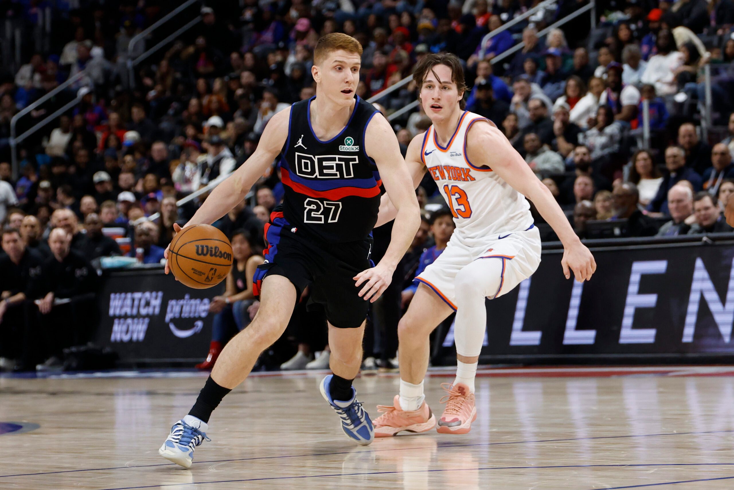 Feb 6, 2026; Detroit, Michigan, USA;  Detroit Pistons guard Kevin Huerter (27) dribbles on New York Knicks guard Tyler Kolek (13) in the second half at Little Caesars Arena. Mandatory Credit: Rick Osentoski-Imagn Images