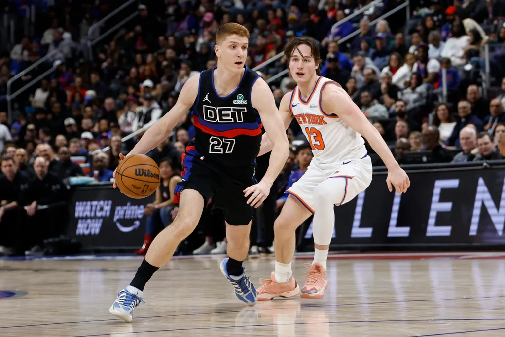 Feb 6, 2026; Detroit, Michigan, USA; Detroit Pistons guard Kevin Huerter (27) dribbles on New York Knicks guard Tyler Kolek (13) in the second half at Little Caesars Arena. Mandatory Credit: Rick Osentoski-Imagn Images