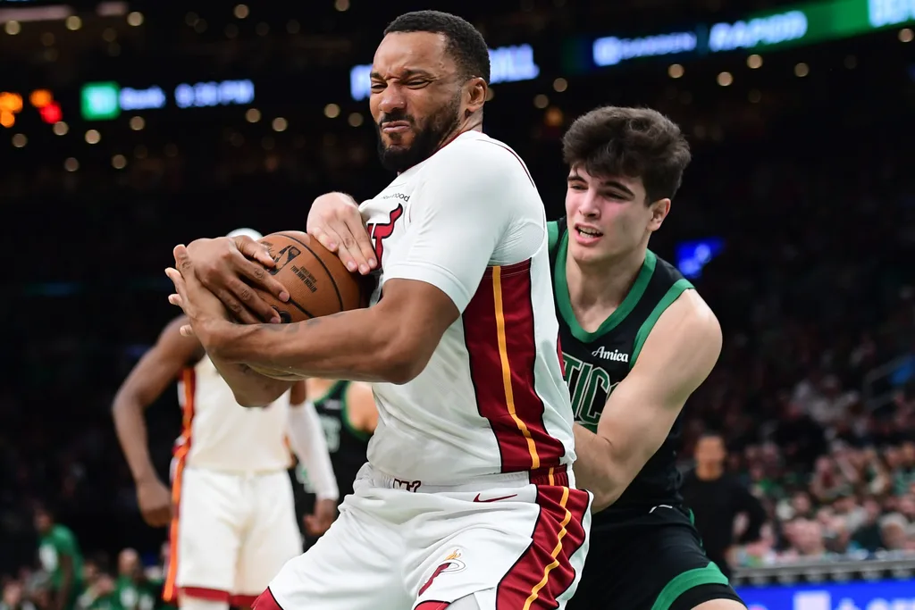 Feb 6, 2026; Boston, Massachusetts, USA; Miami Heat guard Norman Powell (24) and Boston Celtics guard Hugo Gonzalez (28) battle for the ball during the second half at TD Garden. Mandatory Credit: Bob DeChiara-Imagn Images