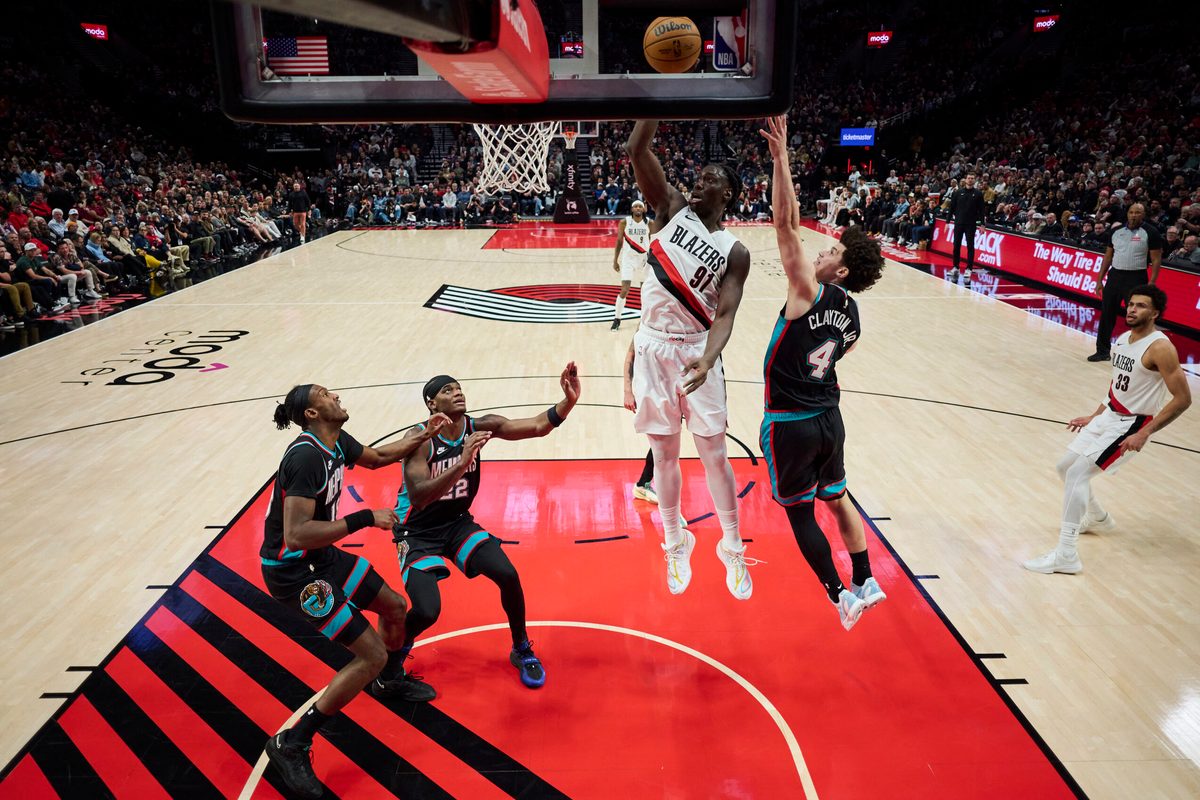 Feb 6, 2026; Portland, Oregon, USA; Portland Trail Blazers guard Sidy Cissoko (91) dunks the basketball during the second half against Memphis Grizzlies guard Walter Claytong Jr. (4) at Moda Center. Mandatory Credit: Troy Wayrynen-Imagn Images