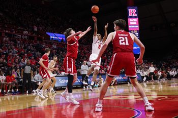 Feb 7, 2026; Piscataway, New Jersey, USA; Rutgers Scarlet Knights guard Tariq Francis (0) shoots the ball against Nebraska Cornhuskers forward Braden Frager (5)  during the second half at Jersey Mike's Arena. Mandatory Credit: Vincent Carchietta-Imagn Images