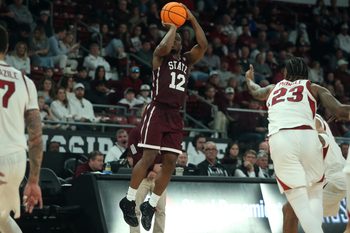Feb 7, 2026; Starkville, Mississippi, USA; Mississippi State Bulldogs guard Josh Hubbard (12) shoots for three during the second half against the Arkansas Razorbacks at Humphrey Coliseum. Mandatory Credit: Petre Thomas-Imagn Images