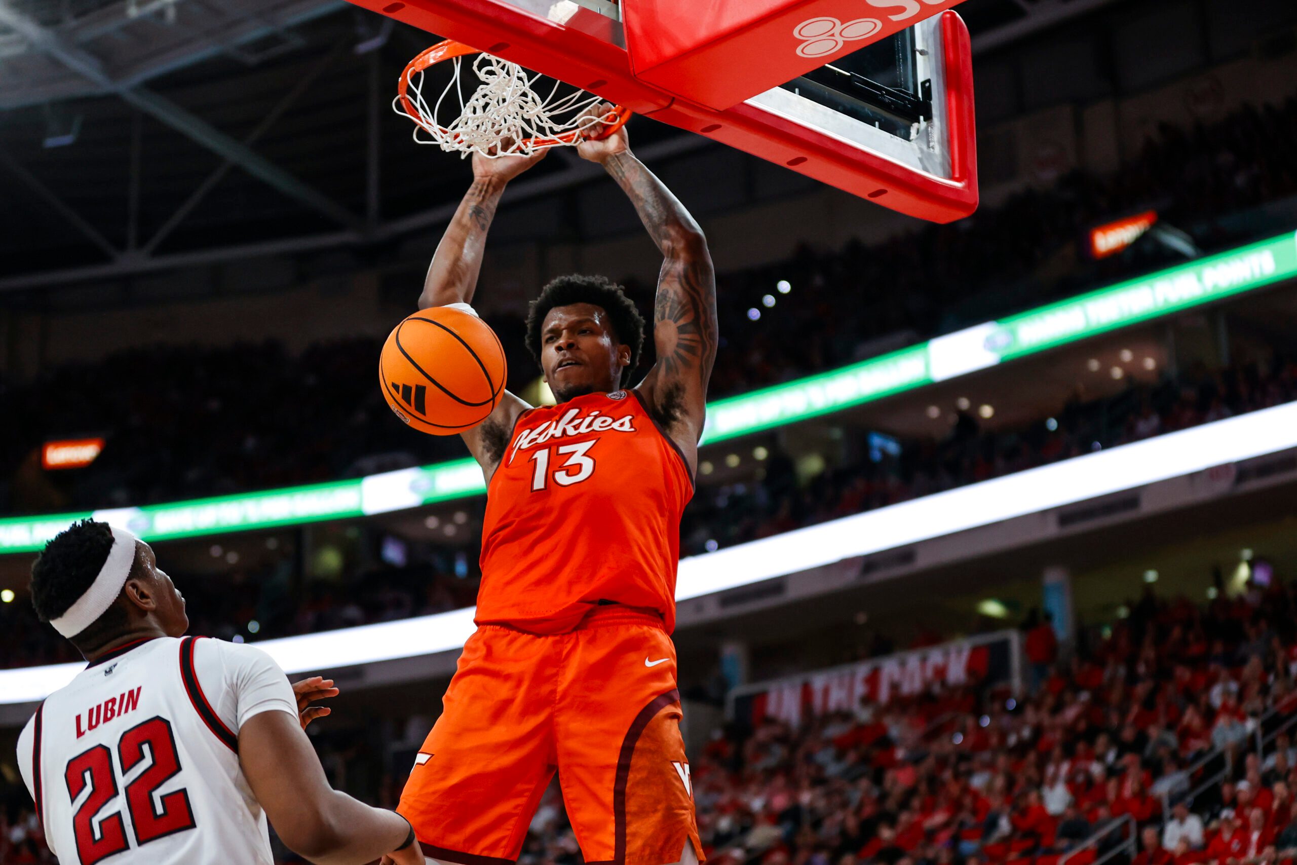 Feb 7, 2026; Raleigh, North Carolina, USA; Virginia Tech Hokies forward Amani Hansberry (13) dunks the ball during the second half of the game against the NC State Wolfpack at Lenovo Center. Mandatory Credit: Jaylynn Nash-Imagn Images