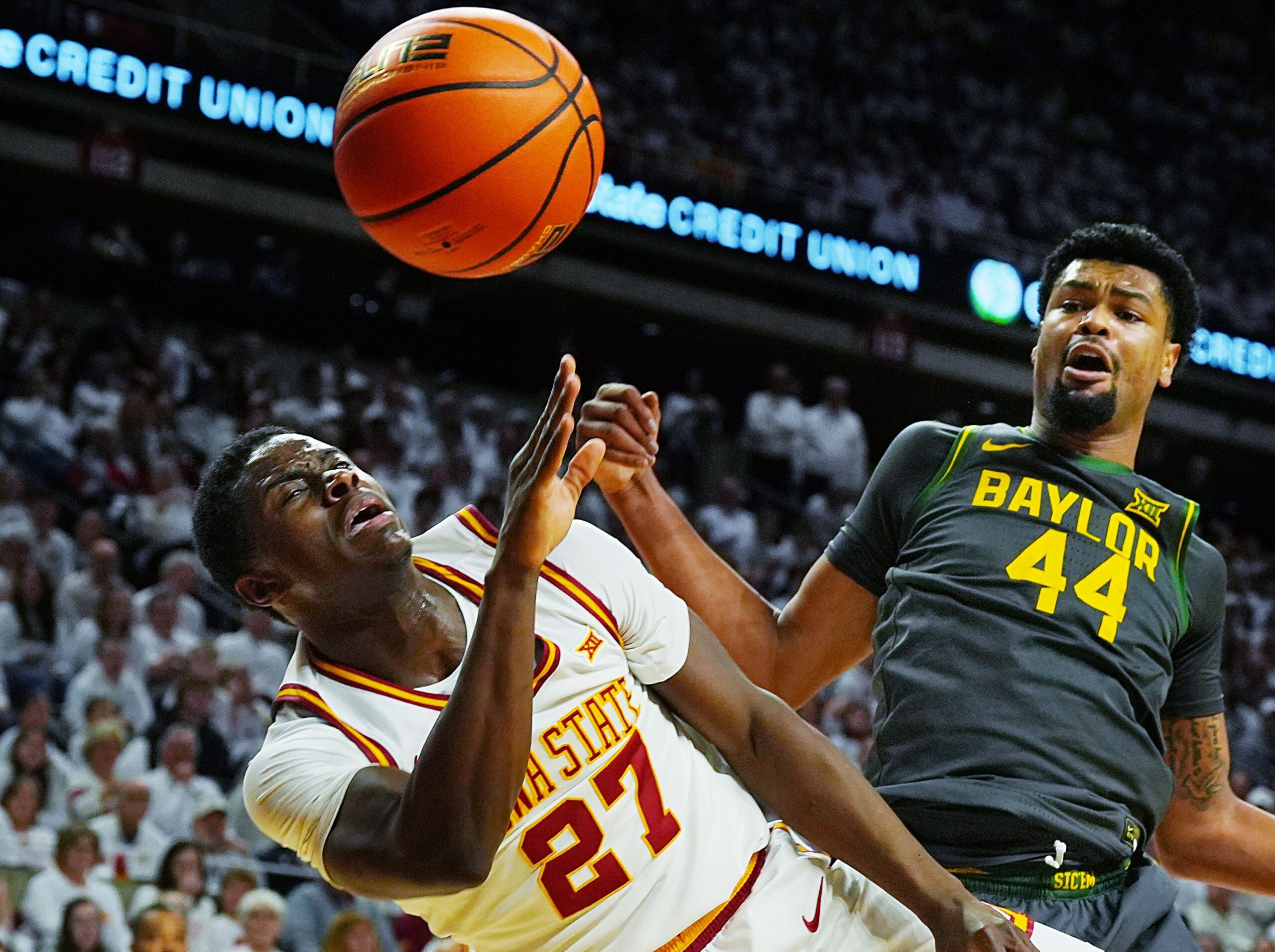 Iowa State Cyclones forward Killyan Toure (27) and Baylor Bears center Caden Powell (44) battle for a loose ball during the first half in the Big-12 men’s basketball on Feb. 7, 2026, at Hilton Coliseum in Ames, Iowa