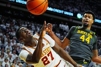 Iowa State Cyclones forward Killyan Toure (27) and Baylor Bears center Caden Powell (44) battle for a loose ball during the first half in the Big-12 men’s basketball on Feb. 7, 2026, at Hilton Coliseum in Ames, Iowa