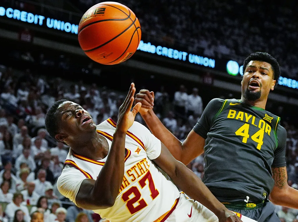 Iowa State Cyclones forward Killyan Toure (27) and Baylor Bears center Caden Powell (44) battle for a loose ball during the first half in the Big-12 men’s basketball on Feb. 7, 2026, at Hilton Coliseum in Ames, Iowa