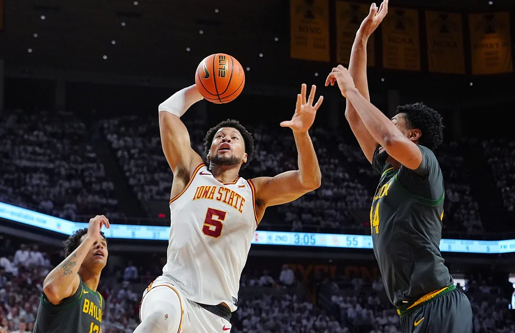 Iowa State Cyclones forward Joshua Jefferson (5) drives with the ball to the basket between Baylor Bears center Caden Powell (44) and Baylor Bears guard Michael Rataj (12) during the second half in the Big-12 men’s basketball on Feb. 7, 2026, at Hilton Coliseum in Ames, Iowa