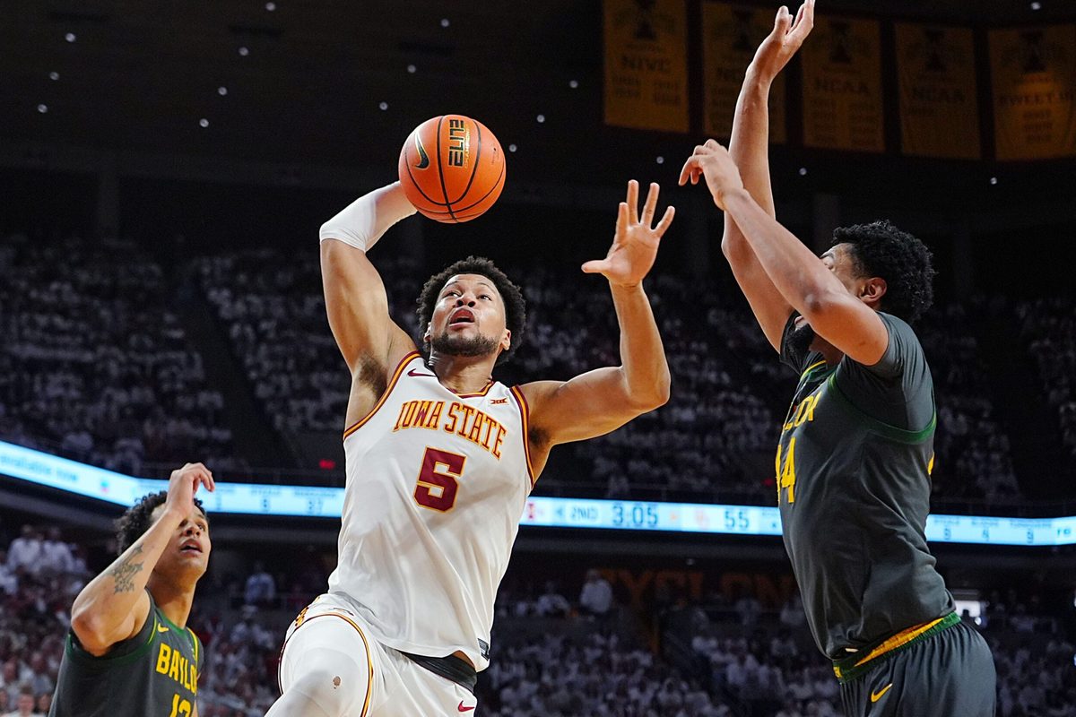 Iowa State Cyclones forward Joshua Jefferson (5) drives with the ball to the basket between Baylor Bears center Caden Powell (44) and Baylor Bears guard Michael Rataj (12) during the second half in the Big-12 men’s basketball on Feb. 7, 2026, at Hilton Coliseum in Ames, Iowa