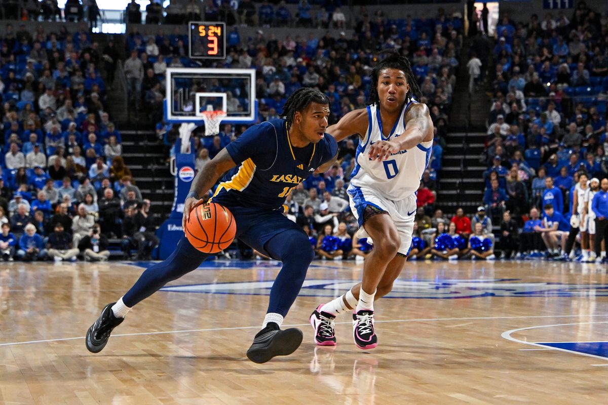 Feb 7, 2026; St. Louis, Missouri, USA; La Salle Explorers guard Jaden Johnson (10) drives to the basket as Saint Louis Billikens guard Kellen Thames (0) defends during the second half at Chaifetz Arena. Mandatory Credit: Jeff Curry-Imagn Images