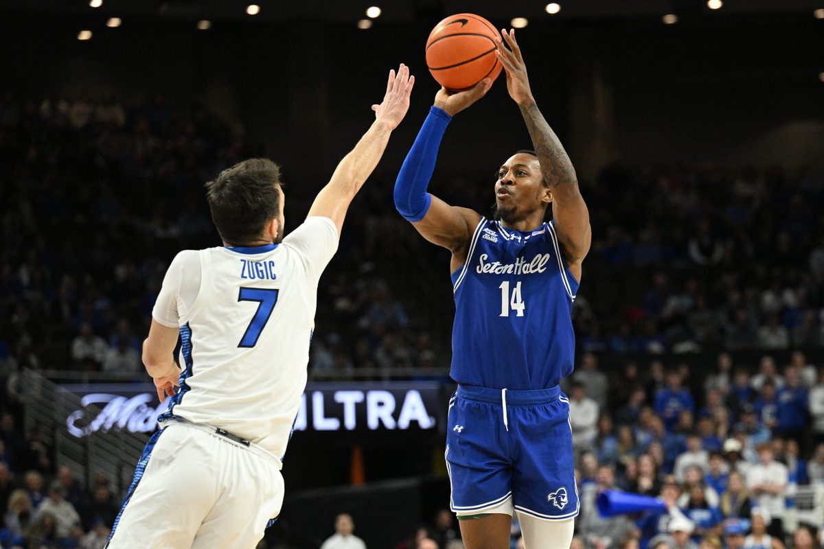 Feb 7, 2026; Omaha, Nebraska, USA; Seton Hall Pirates guard AJ Staton-McCray (14) makes a three point basket against Creighton Bluejays guard Fedor Zugic (7) during the first half at CHI Health Center Omaha. Mandatory Credit: Steven Branscombe-Imagn Images