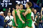 Feb 7, 2026; South Bend, Indiana, USA; Notre Dame Fighting Irish guard Braeden Shrewsberry, right, and Cole Certa (5) celebrate with guard Logan Imes, center, after he made a three-point basket during the second half at Purcell Pavilion at the Joyce Center. Mandatory Credit: Michael Caterina-Imagn Images