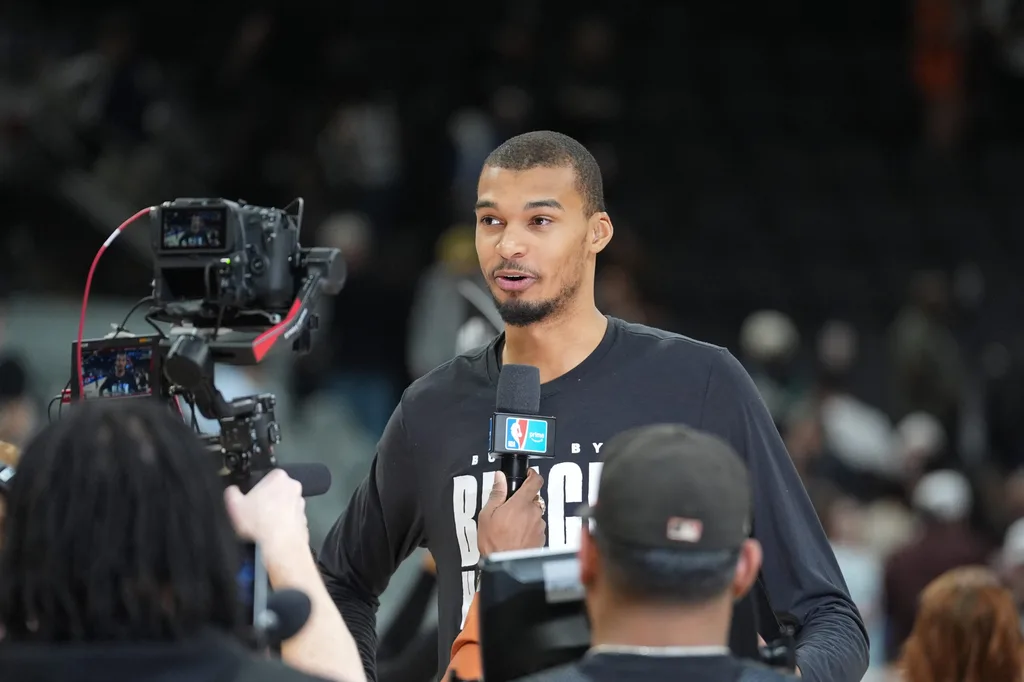 Feb 7, 2026; San Antonio, Texas, USA; San Antonio Spurs forward Victor Wembanyama (1) gives an interview after the game against the Dallas Mavericks at Frost Bank Center. Mandatory Credit: Daniel Dunn-Imagn Images