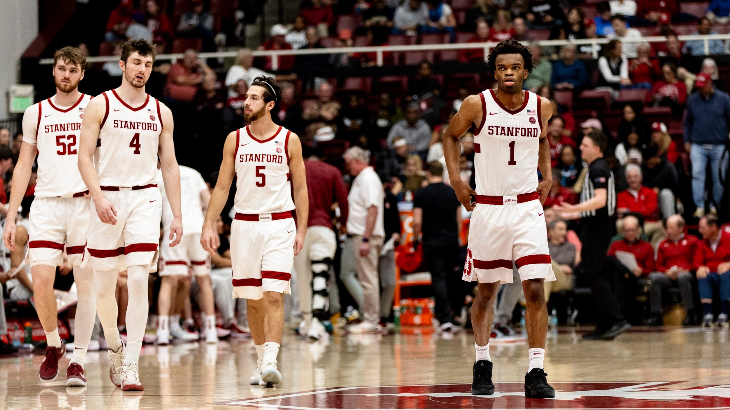Feb 7, 2026; Stanford, California, USA;  Stanford Cardinal guard Ebuka Okorie (1) andguard Benny Gealer (5) and forward AJ Rohosy (4) and forward Aidan Cammann (52) enter the court after a time-out in the second half against the Georgia Tech Yellow Jackets  at Maples Pavilion. Mandatory Credit: John Hefti-Imagn Images