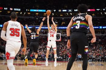 Feb 7, 2026; Chicago, Illinois, USA; Chicago Bulls forward Matas Buzelis (14) shoots over Denver Nuggets guard Jamal Murray (27) during the second half at United Center. Mandatory Credit: David Banks-Imagn Images