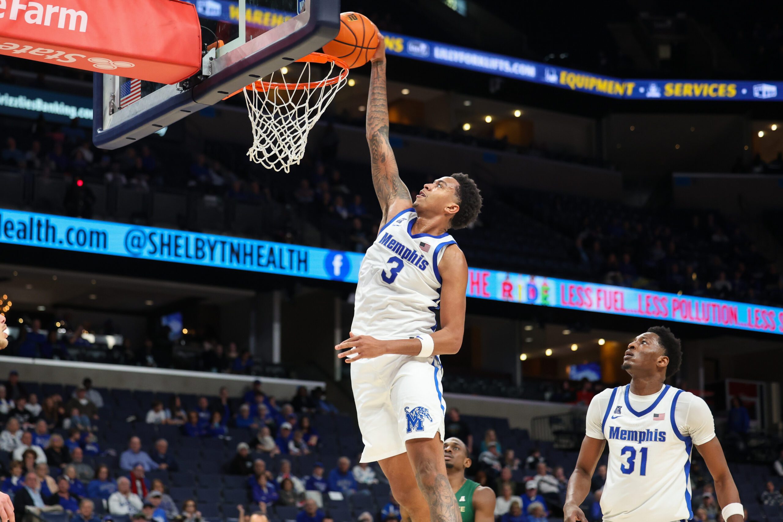 Feb 8, 2026; Memphis, Tennessee, USA; Memphis Tigers forward Ashton Hardaway (3) dunks the ball against the Charlotte 49ers during the second half at FedExForum. Mandatory Credit: Wesley Hale-Imagn Images