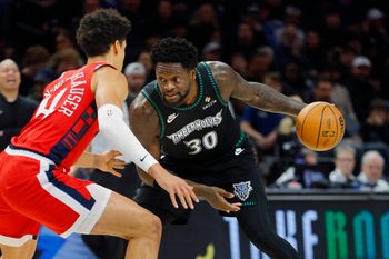 Feb 8, 2026; Minneapolis, Minnesota, USA; Minnesota Timberwolves forward Julius Randle (30) works around Los Angeles Clippers center Yanic Konan Niederhauser (14) in the second quarter at Target Center. Mandatory Credit: Bruce Kluckhohn-Imagn Images