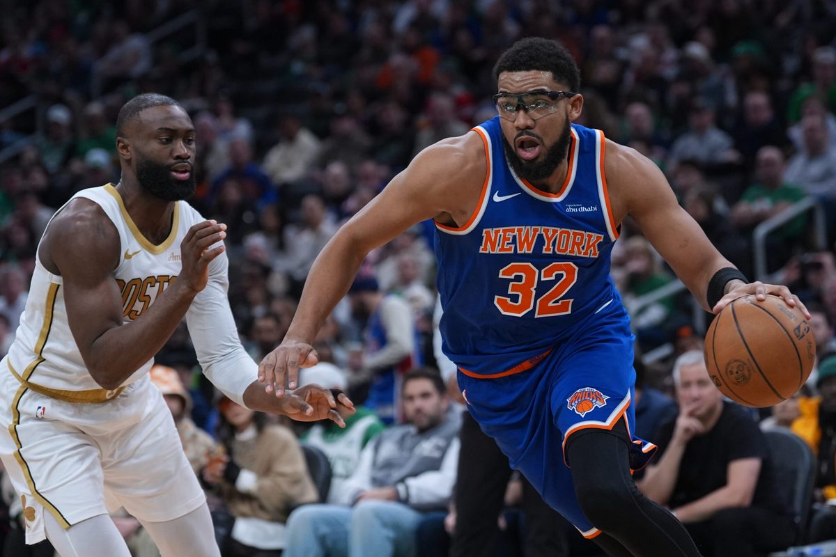 Feb 8, 2026; Boston, Massachusetts, USA; New York Knicks center Karl-Anthony Towns (32) drives the ball against Boston Celtics guard Jaylen Brown (7) in the second quarter at TD Garden. Mandatory Credit: David Butler II-Imagn Images