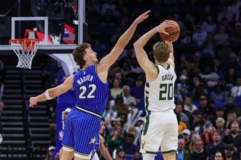 Feb 9, 2026; Orlando, Florida, USA; Orlando Magic forward Franz Wagner (22) defends Milwaukee Bucks guard AJ Green (20) during the second half at Kia Center. Mandatory Credit: Mike Watters-Imagn Images