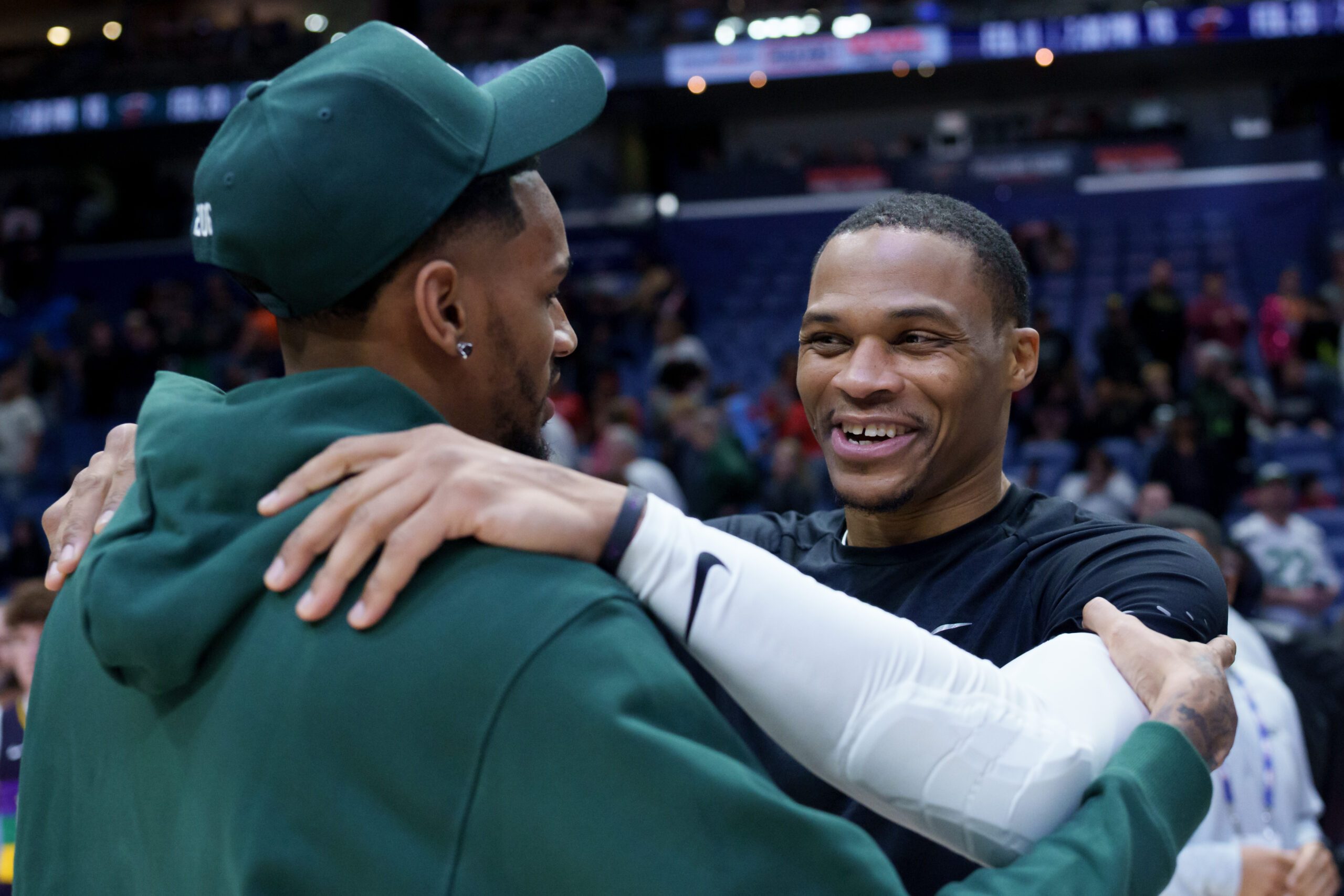 Feb 9, 2026; New Orleans, Louisiana, USA; Sacramento Kings guard Russell Westbrook, right, hugs New Orleans Pelicans guard Dejounte Murray at Smoothie King Center. Mandatory Credit: Matthew Hinton-Imagn Images