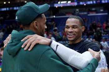 Feb 9, 2026; New Orleans, Louisiana, USA; Sacramento Kings guard Russell Westbrook, right, hugs New Orleans Pelicans guard Dejounte Murray at Smoothie King Center. Mandatory Credit: Matthew Hinton-Imagn Images