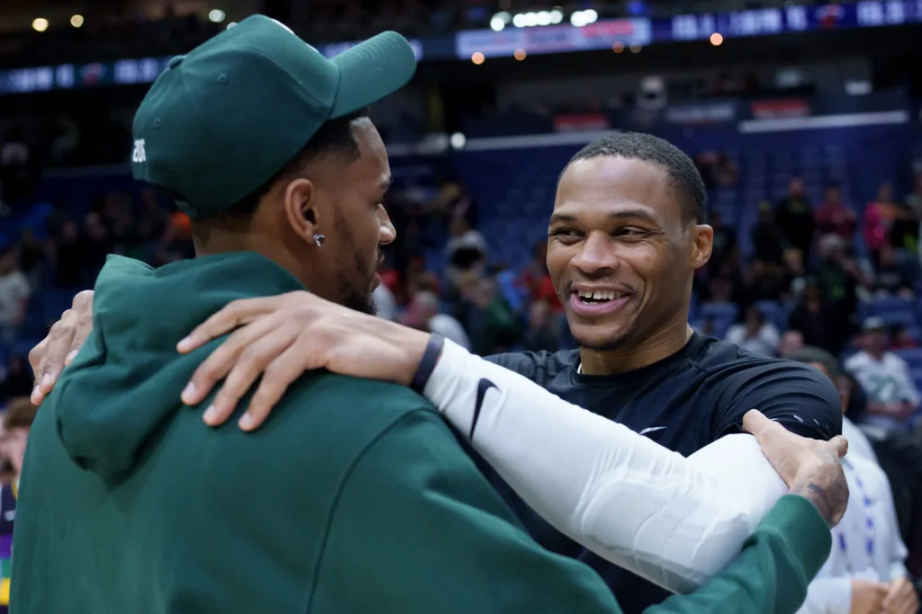 Feb 9, 2026; New Orleans, Louisiana, USA; Sacramento Kings guard Russell Westbrook, right, hugs New Orleans Pelicans guard Dejounte Murray at Smoothie King Center. Mandatory Credit: Matthew Hinton-Imagn Images
