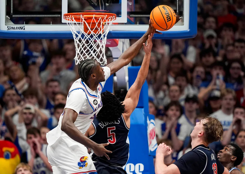 Feb 9, 2026; Lawrence, Kansas, USA; Kansas Jayhawks forward Flory Bidunga (40) blocks the shot of Arizona Wildcats guard Brayden Burries (5) during the second half at Allen Fieldhouse. Mandatory Credit: Jay Biggerstaff-Imagn Images