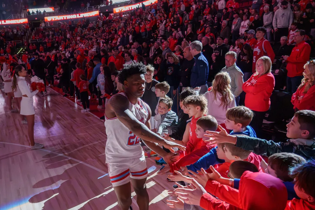 Young fans reach for Bradley's Jaquan Johnson during player introductions before the start of a college basketball game Monday, Feb. 9, 2026 at Carver Arena in Peoria. The Braves defeated the Belmont Bruins 95-84 in overtime.