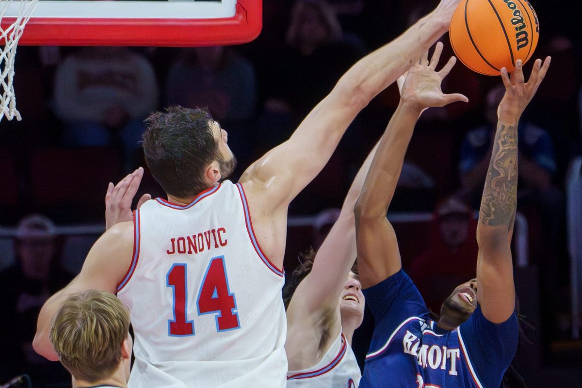 Bradley’s Ahmet Jonovic (14) tries to knock a rebound away from Belmont’s Jabez Jenkins in the overtime period of their college basketball game Monday, Feb. 9, 2026 at Carver Arena in Peoria. The Braves defeated the Bruins 95-84.