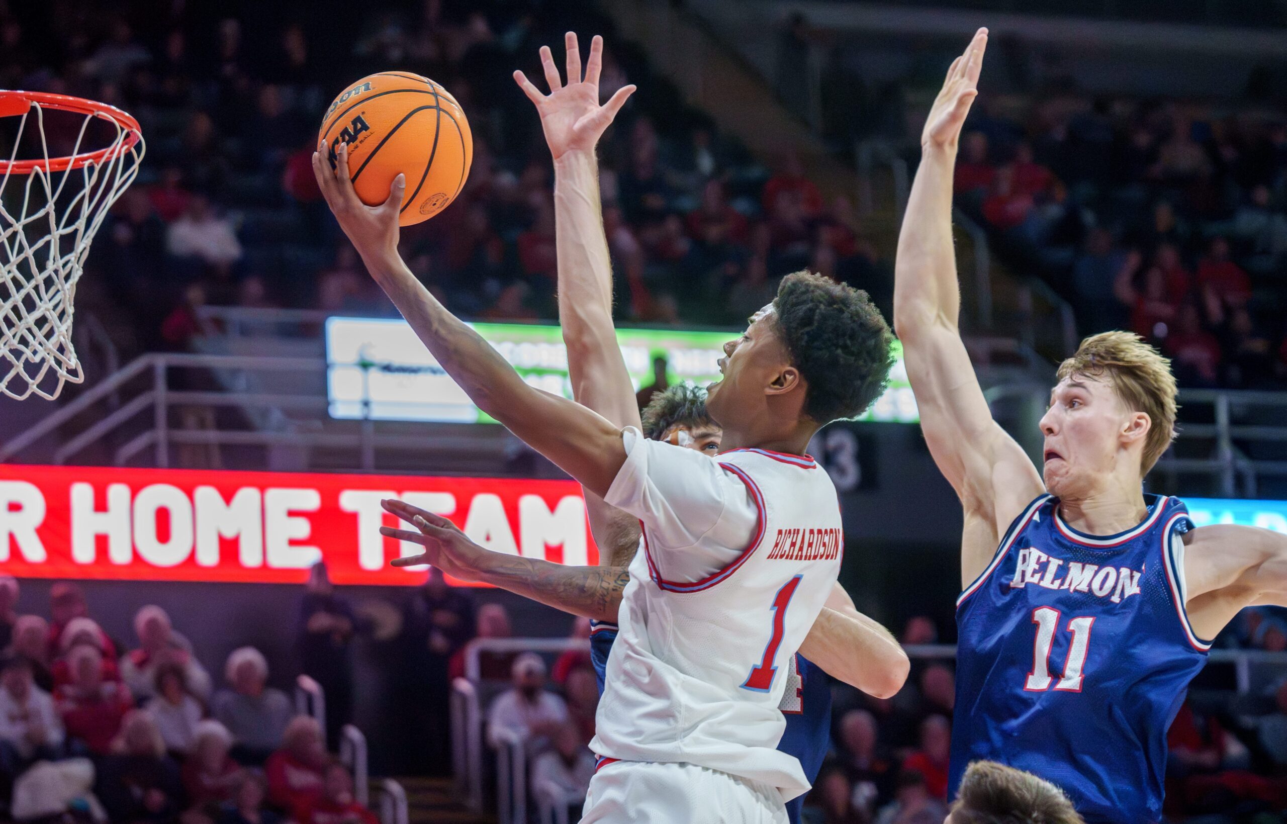 Bradley’s Dietrich Richardson (1) drives to the basket against Belmont in the first half of their college basketball game Monday, Feb. 9, 2026 at Carver Arena in Peoria. The Braves defeated the Bruins 95-84.