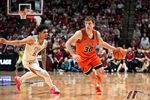 Feb 10, 2026; Tallahassee, Florida, USA; Virginia Cavaliers guard Dallin Hall (30) drives the ball up the court past Florida State Seminoles guard Kobe Magee (5) during the second half at Donald L. Tucker Center. Mandatory Credit: Melina Myers-Imagn Images