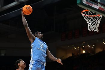 Feb 10, 2026; Coral Gables, Florida, USA; North Carolina Tar Heels forward Caleb Wilson (8) dunks against the Miami Hurricanes during the second half at Watsco Center. Mandatory Credit: Sam Navarro-Imagn Images