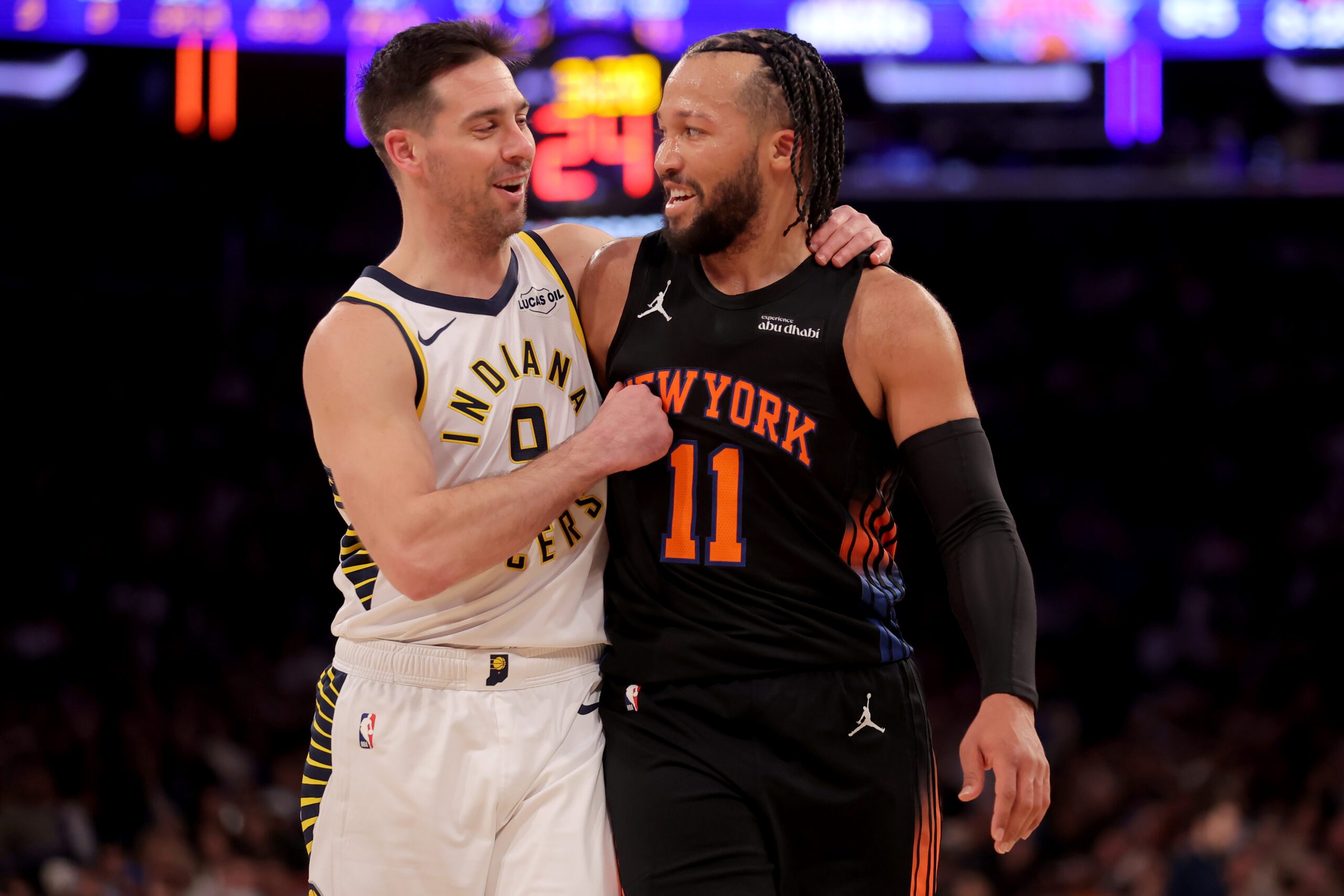 Feb 10, 2026; New York, New York, USA; Indiana Pacers guard T.J. McConnell (9) puts his arm around New York Knicks guard Jalen Brunson (11) during the third quarter at Madison Square Garden. Mandatory Credit: Brad Penner-Imagn Images