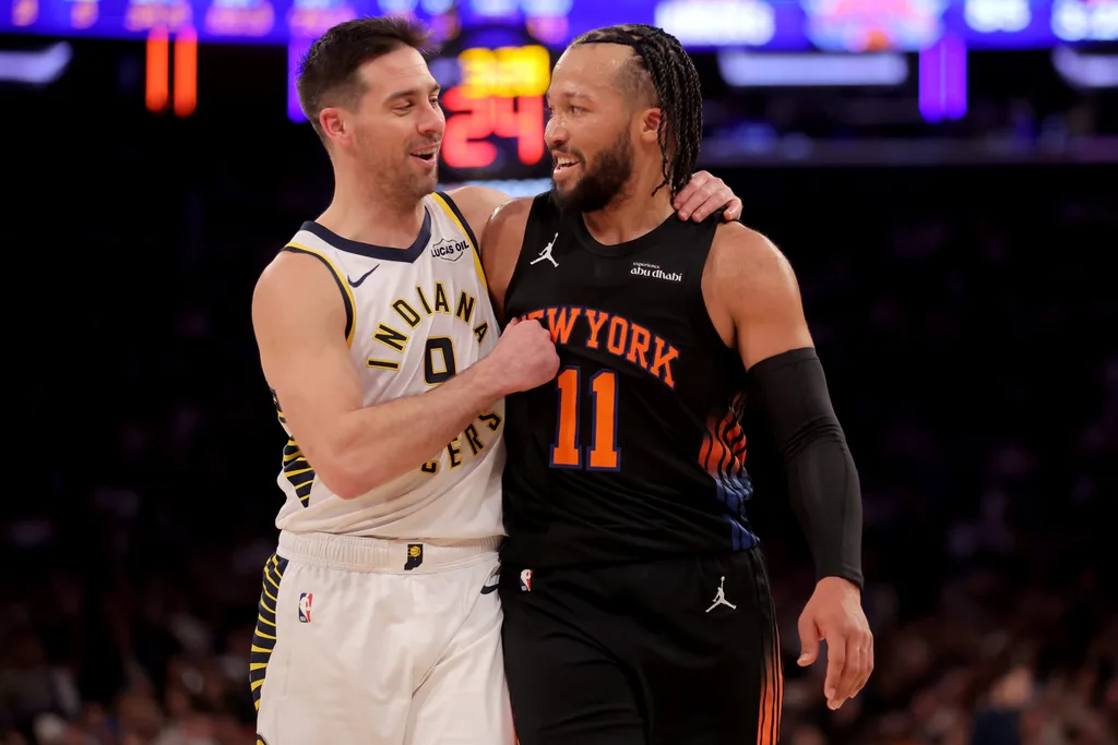 Feb 10, 2026; New York, New York, USA; Indiana Pacers guard T.J. McConnell (9) puts his arm around New York Knicks guard Jalen Brunson (11) during the third quarter at Madison Square Garden. Mandatory Credit: Brad Penner-Imagn Images